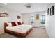 Spacious bedroom with two shuttered windows, plush carpet, and recessed lighting at 3131 E Alameda Ave # 1107, Denver, CO 80209