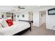 Well lit bedroom features a ceiling fan, carpeted floors and mirrored closet at 3131 E Alameda Ave # 1107, Denver, CO 80209