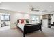 Bright bedroom with a ceiling fan, mirrored closet, and connected sunroom with exercise bike at 3131 E Alameda Ave # 1107, Denver, CO 80209