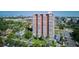 A high-rise apartment building boasts a prime location with scenic city views and mature tree landscaping at 3131 E Alameda Ave # 1107, Denver, CO 80209