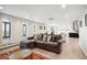 Spacious living area with a large sectional, hardwood floors, many windows, and an open layout at 3131 E Alameda Ave # 1107, Denver, CO 80209