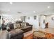 Open concept living room with wood floors, spiral staircase, and views of dining and office space at 3131 E Alameda Ave # 1107, Denver, CO 80209