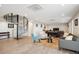 Light-filled living space with spiral staircase, hardwood floors, and comfortable seating arrangement at 3131 E Alameda Ave # 1107, Denver, CO 80209