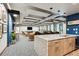 Resident lounge featuring a kitchen island, multiple seating areas, and contemporary design at 3131 E Alameda Ave # 1107, Denver, CO 80209