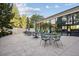 Stylish outdoor patio with contemporary furniture, umbrellas, and views of mature trees at 3131 E Alameda Ave # 1107, Denver, CO 80209