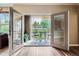 Inviting outdoor balcony featuring glass doors and seating area with views of the yard at 7462 S Quail Cir # 426, Littleton, CO 80127
