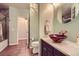 Bathroom with a red bowl sink and wood design at 7462 S Quail Cir # 426, Littleton, CO 80127