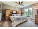 Spacious primary bedroom suite featuring a window view, ceiling fan and ample closet space at 7462 S Quail Cir # 426, Littleton, CO 80127
