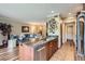 Open concept kitchen features granite island with a view of the comfortable living space at 7462 S Quail Cir # 426, Littleton, CO 80127