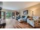 Cozy living room with access to balcony, filled with natural light at 7462 S Quail Cir # 426, Littleton, CO 80127