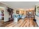 Spacious living room with hardwood floors that flow into the dining area and kitchen at 7462 S Quail Cir # 426, Littleton, CO 80127