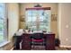 Comfortable home office area featuring a wooden desk and natural light from a window at 7462 S Quail Cir # 426, Littleton, CO 80127