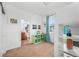 Bedroom with loft bed, green shelves, and view into the adjoining bathroom at 1106 Oak Cir, Lakewood, CO 80215