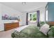 Cozy bedroom with large window seat, neutral walls, and stylish decor at 1106 Oak Cir, Lakewood, CO 80215