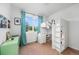 A bedroom with a loft bed and desk, and bright green decor at 1106 Oak Cir, Lakewood, CO 80215