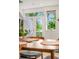 Cozy dining area with a wooden table and chairs, and a view of the outdoor space at 1106 Oak Cir, Lakewood, CO 80215