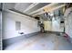 Spacious garage with ample storage solutions, including shelving and bike racks, on an epoxy floor at 1106 Oak Cir, Lakewood, CO 80215