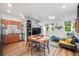 Bright living room featuring an open floor plan, modern furnishings, and beautiful hardwood flooring at 1106 Oak Cir, Lakewood, CO 80215