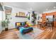 Bright living area with hardwood floors, plenty of natural light, and modern furnishings at 1106 Oak Cir, Lakewood, CO 80215