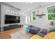 Cozy living area featuring hardwood floors, modern furnishings, and plenty of natural light at 1106 Oak Cir, Lakewood, CO 80215