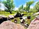 Scenic shot of a creek with natural rock features and lush vegetation along the banks at 1106 Oak Cir, Lakewood, CO 80215