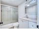 Modern bathroom with a shower and tub combination, updated sink, and new fixtures at 6500 E 88Th Ave # 258, Henderson, CO 80640