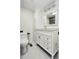Bright bathroom with white vanity, storage cabinet, and tile flooring at 6500 E 88Th Ave # 258, Henderson, CO 80640