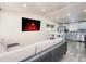 Cozy open-concept living room featuring updated flooring, a fireplace, and stainless-steel appliances at 6500 E 88Th Ave # 258, Henderson, CO 80640