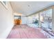 Covered brick patio with wooden gate and partial view of backyard at 6500 E 88Th Ave # 258, Henderson, CO 80640