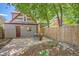 Fenced backyard with patio and landscaping at 3047 Osceola St, Denver, CO 80212