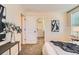 Bright bedroom with closet view, plush carpets, and simple artwork at 3047 Osceola St, Denver, CO 80212