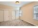 Carpeted bedroom featuring two closets and a window at 3047 Osceola St, Denver, CO 80212