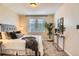 Bedroom with stylish decor, plush carpets, accent console, and great natural light at 3047 Osceola St, Denver, CO 80212