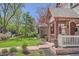 Street view of a charming home with well-maintained landscaping, featuring a inviting front porch and walkway at 3047 Osceola St, Denver, CO 80212