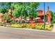 Colorful bistro exterior with painted mural, outdoor seating, and lush landscaping at 3047 Osceola St, Denver, CO 80212