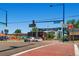 Intersection of a neighborhood commercial area with shops, restaurants, and community signs at 3047 Osceola St, Denver, CO 80212