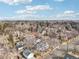 Wide aerial view of a residential neighborhood featuring various houses and tree-lined streets at 1601 Leyden St, Denver, CO 80220