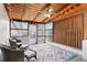 Relaxing sunroom with wicker furniture and wood ceiling at 1601 Leyden St, Denver, CO 80220