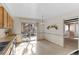 Bright kitchen with a sliding door and tiled floor, adjacent to dining area at 4651 S Kalispell Way, Aurora, CO 80015