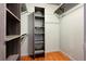 Walk-in closet with custom shelving units and hanging rods for organization at 2958 Syracuse St # 306, Denver, CO 80238