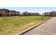 Well-maintained lawn, bordered by a walkway at 2958 Syracuse St # 306, Denver, CO 80238