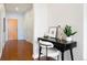 Hallway features a dark wood floor and stylish black desk, with decorative objects and a houseplant at 2958 Syracuse St # 306, Denver, CO 80238