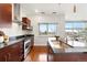 Bright kitchen features stainless steel appliances and hardware, granite counters, and wood cabinets at 2958 Syracuse St # 306, Denver, CO 80238