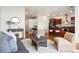 Cozy living room blending seamlessly with an open kitchen and dining area at 2958 Syracuse St # 306, Denver, CO 80238