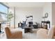 Bright living room featuring modern furnishings, large windows, and hardwood floors at 2958 Syracuse St # 306, Denver, CO 80238