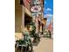 Lovely street view shot of shops with great curb appeal and a sidewalk with outdoor seating at 2958 Syracuse St # 306, Denver, CO 80238