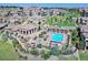 Aerial view of community pool and hot tub area with lounge chairs and pergola at 3181 Firenze Pl, Highlands Ranch, CO 80126