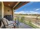Inviting balcony with seating, a grill, and serene views of the surrounding area at 3181 Firenze Pl, Highlands Ranch, CO 80126