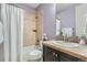 Neutral bathroom with a shower-tub combination and a dark vanity cabinet at 3181 Firenze Pl, Highlands Ranch, CO 80126