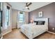 Bright bedroom with white furniture, carpet, and ceiling fan for comfortable living at 3181 Firenze Pl, Highlands Ranch, CO 80126